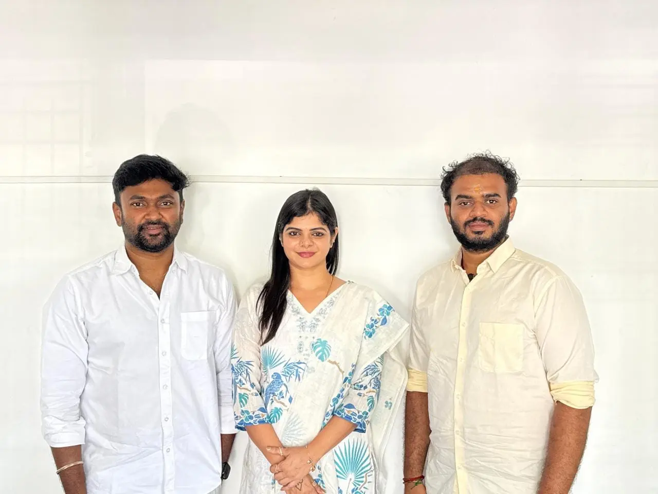 Sakthi Vignesh with two guests at a recognition event