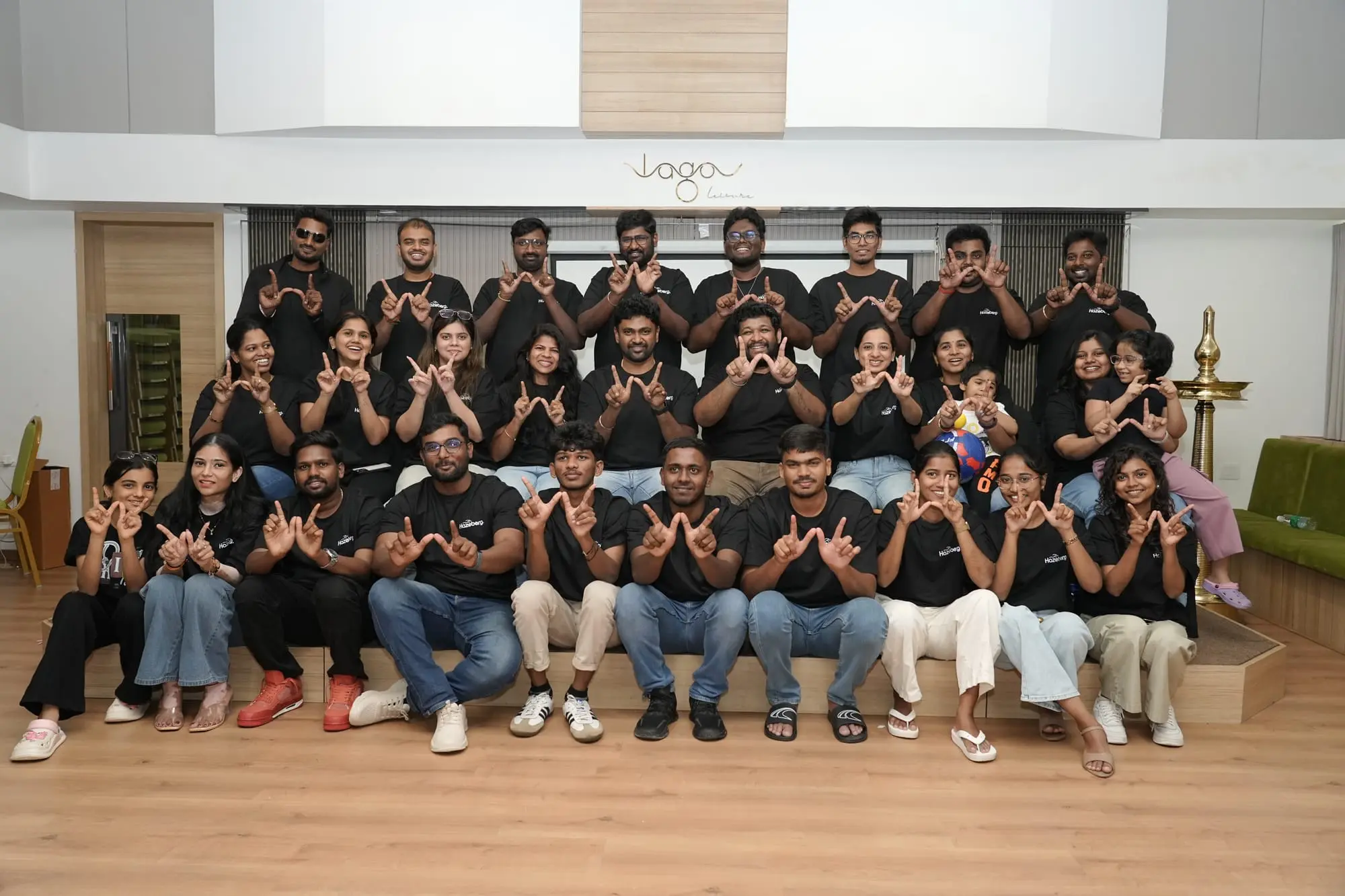The whole team posing together indoors at the 2026 offsite