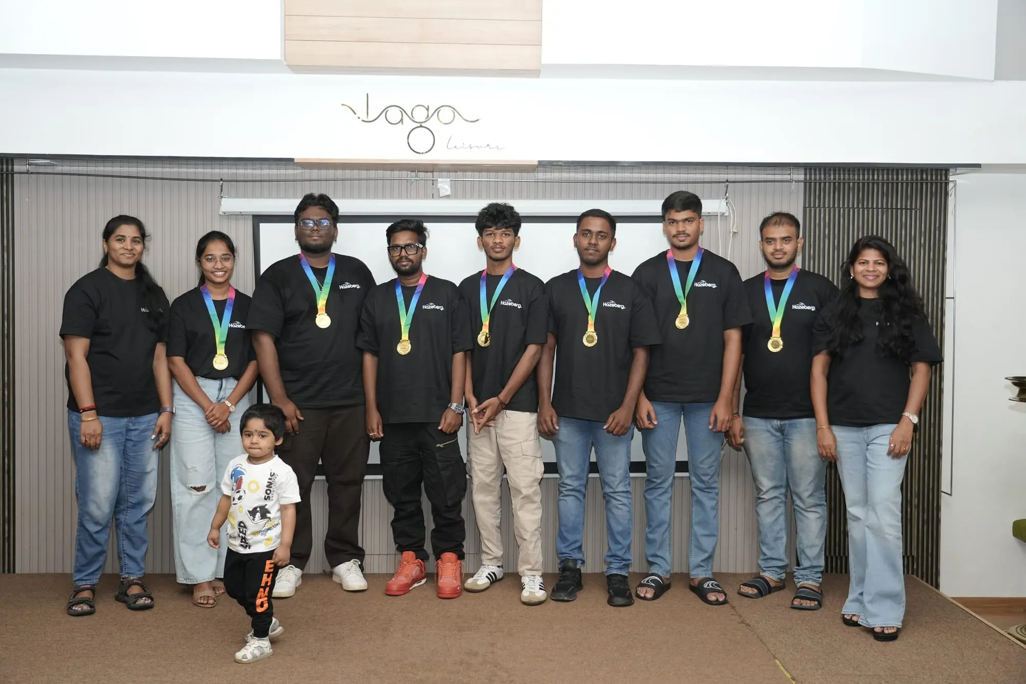 A row of team members wearing their medals
