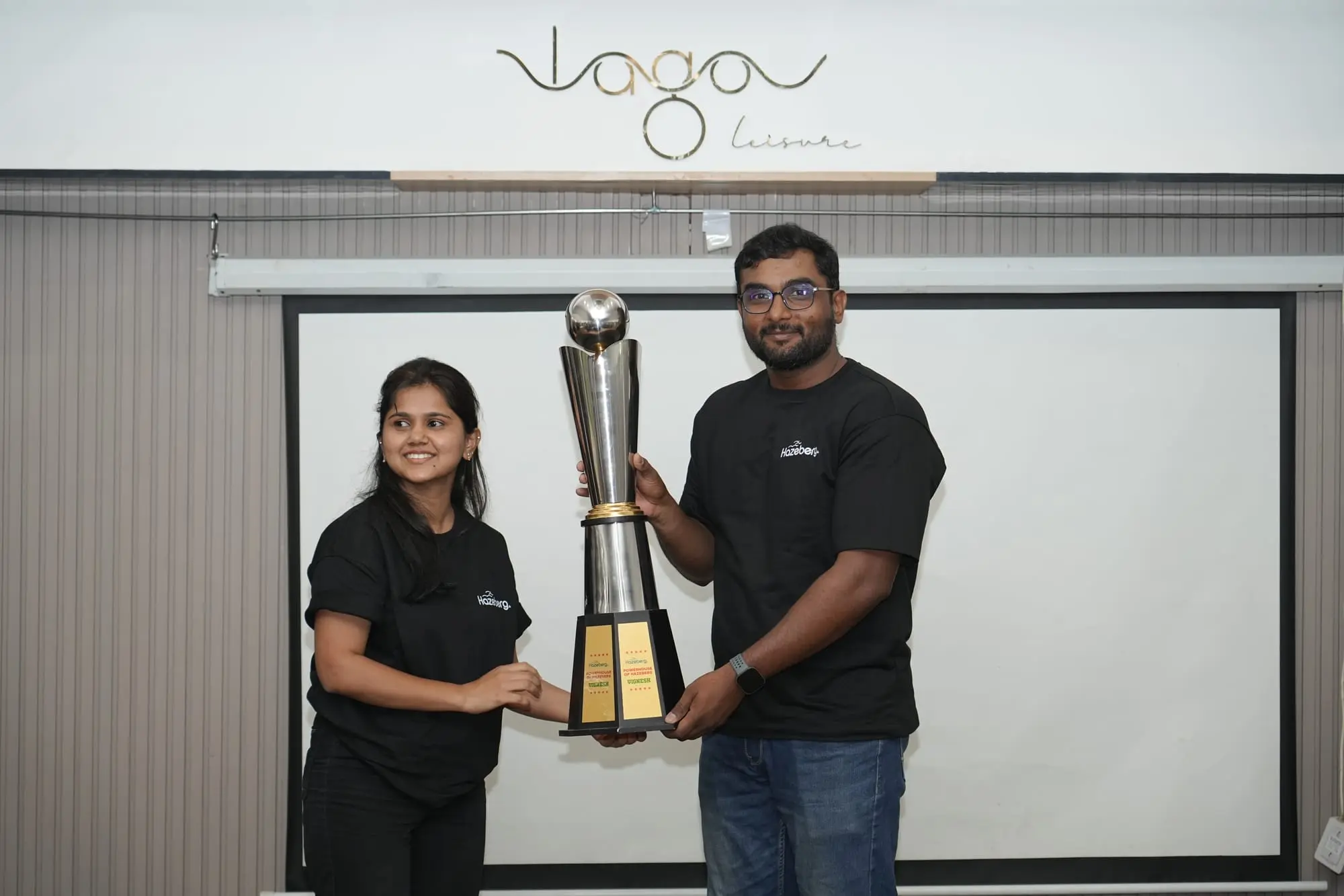 Vignesh receiving his trophy